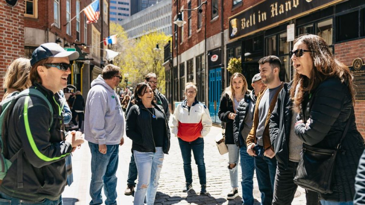 a group of people walking down a street