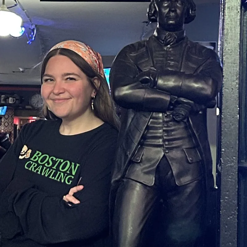 IMG_2687 (1) a woman standing in front of a store