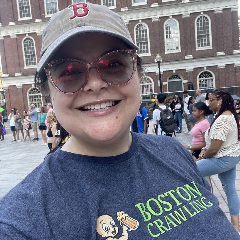 IMG_5602 a person standing in front of a building